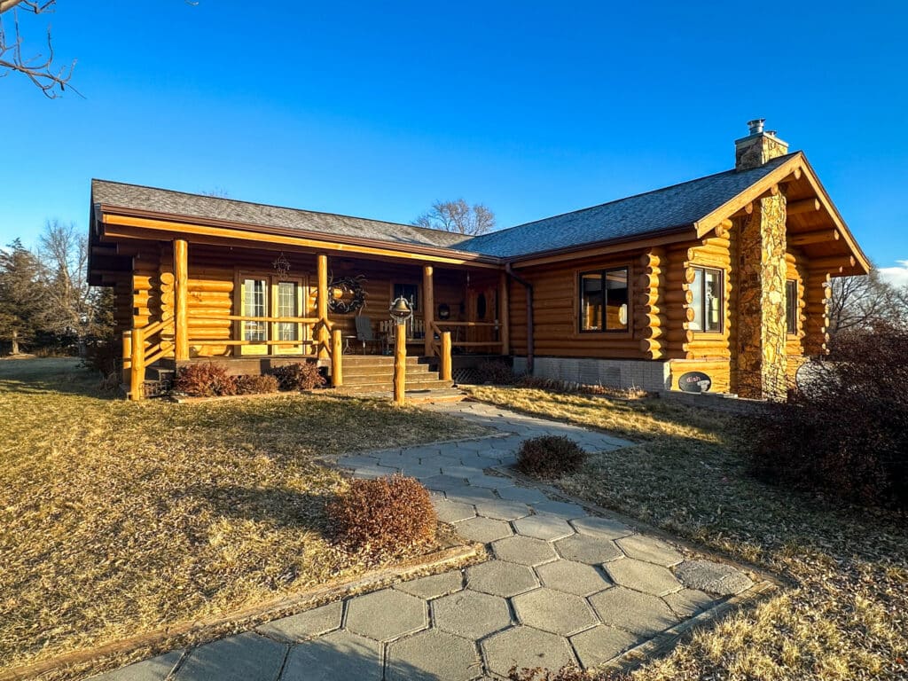 Beautiful 4 bedroom log home on recreational ranch near Valentine, NE. Listed by Swan Land Company