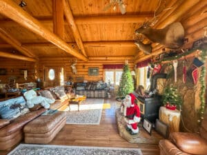 High ceilings in the beautiful log home on this Nebraska ranch for sale.