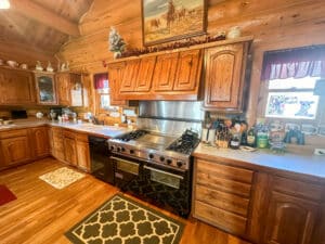 Beautiful kitchen in the log home on this Nebraska ranch for sale.