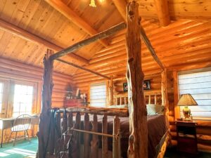 One of four bedrooms in beautiful log home on Nebraska ranch.